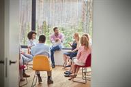 A group of people taking part in a therapy session.