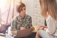 A child talking with a mental health care provider.