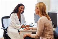 A person talking with a health care provider.