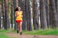 A person running on a dirt path.