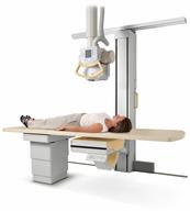 A person lying down on an X-ray table.