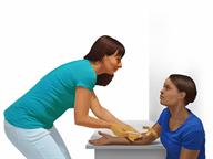 A person having a blood sample taken from the arm.