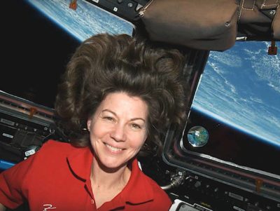 Cady with one of the planets she brought onto the International Space Station as a part of the Infinity Project. Photo courtesy of Josh Simpson and Cady Coleman.