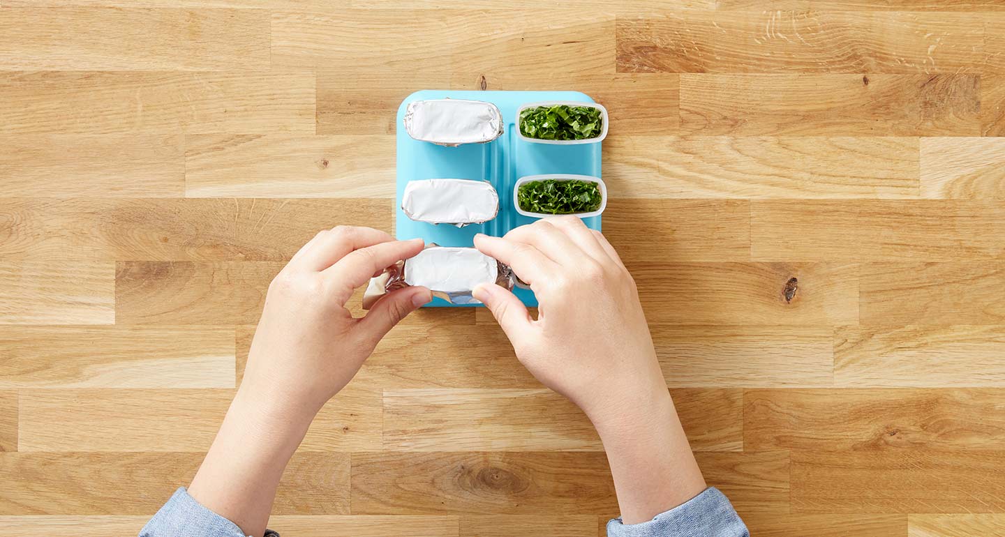 Cover each of the filled plastic molds with aluminum foil and gently cut a small X into the middle using the knife.