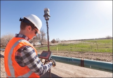 A technician uses an imaging rover to collect images and position data on a pipeline weld prior to trenching and backfill.