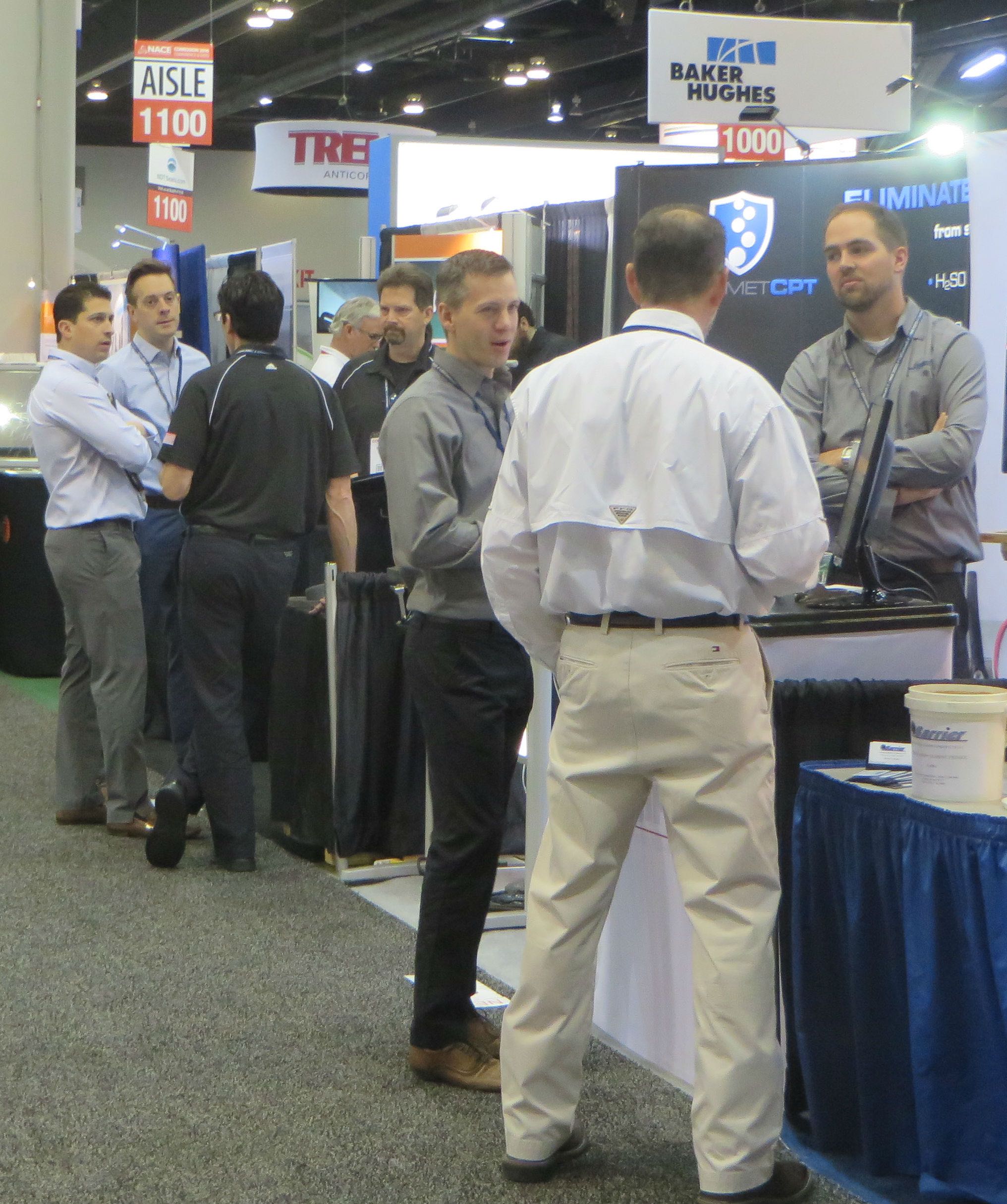 Attendees gather around one of about 350 exhibits on display at NACE Corrosion 2016.