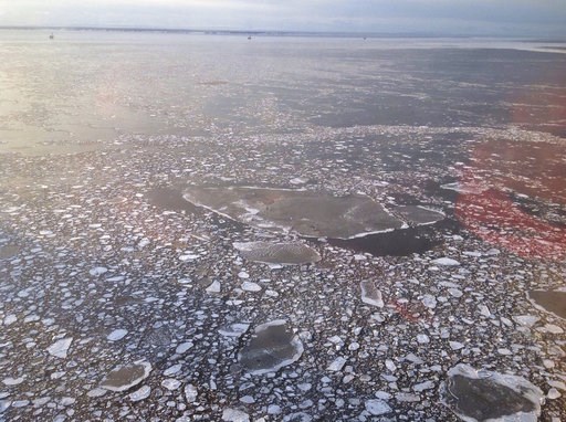File - This April 3, 2017 photo provided by Cook Inlet Spill Prevention and Response, Inc. shows pan ice taken during an agency overflight near a Hilcorp Alaska LLC offshore platform in Cook Inlet, Alaska. Alaska's Cook Inlet is home to endangered beluga whales, a significant slice of the state's wild salmon population, and along the sea floor, a spider web of petroleum pipelines. So when natural gas was found spewing from an underwater pipeline belonging to the area's largest petroleum producer, alarm bells went off. (Derek Samora/CISPRI via AP, File)