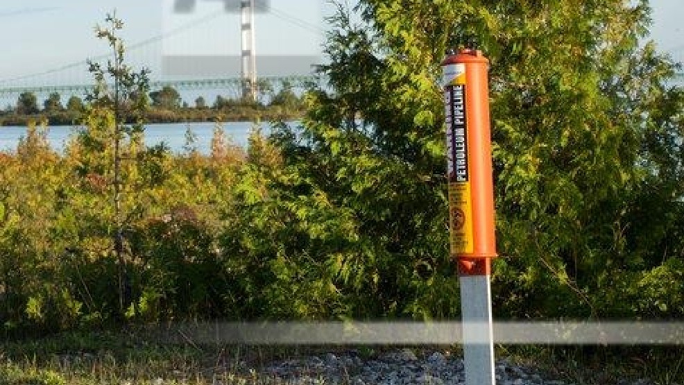FILE- In this Sept. 23, 2015, file photo, the Mackinac Bridge is visible from a marker near Enbridge Line 5 on the northern shore of the Straits of Mackinac in Michigan. (AP photo)