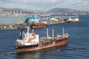 An oil tanker enters Burrard Inlet. The docks are part of Kinder Morgan terminals, formerly known as Vancouver Wharves. (Photo by Michael Chu)