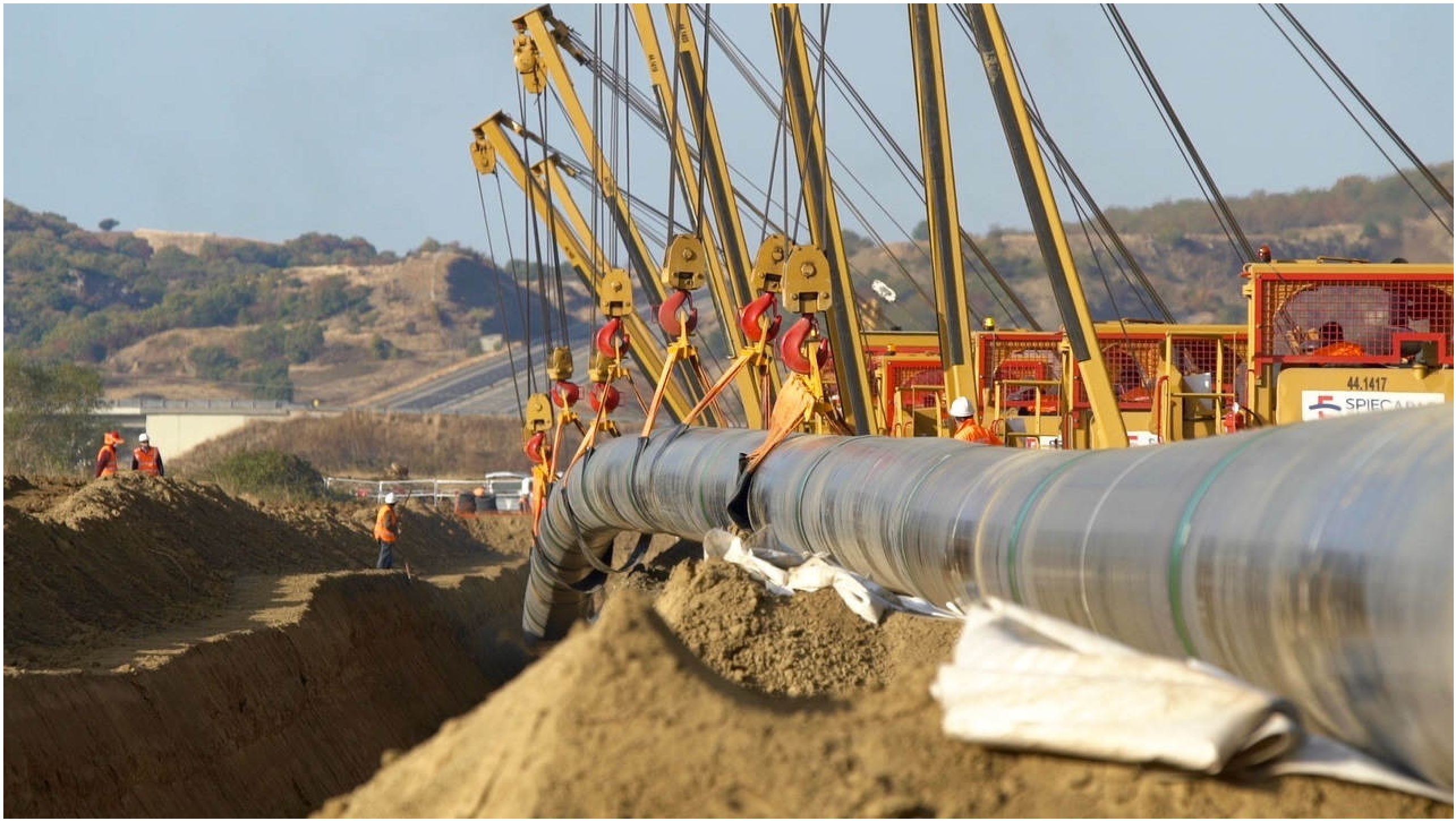 Welded steel pipes are lowered into trenches in northern Greece during November construction efforts. (Photo courtesy of Trans Adriatic Pipeline)
