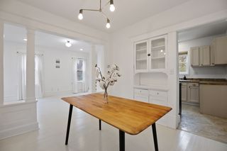 Dining room with living room on left and kitchen on right