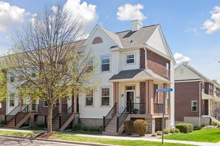 Lovely townhome on a spacious corner lot.  Porch wraps around with space for small table and chairs.