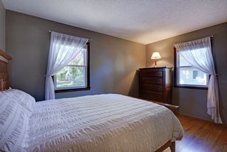 Master bedroom with hardwoods and newer windows