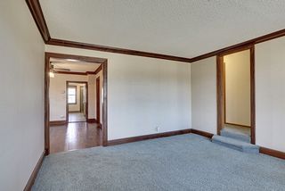 This living area adjoins dining and main floor bedroom hallways.
