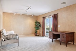 Second area of lower level family room with walk-out to patio and large green space.