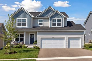 So verdant with the blue and white front exterior hues and clean structural lines. 
 The home boasts a spacious three bay garage.