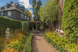 The Southern Sunroom leads to the beautiful gardens with Pergola & Stone Pathways...