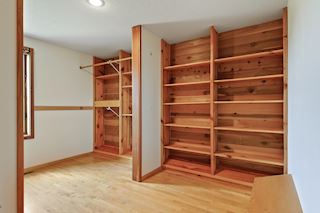 Incredibly spacious master walk-in closet with custom built-ins