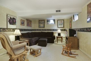 Enjoy entertaining friends or relax with family in inviting lower level family room...