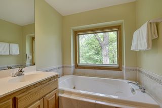 Relax in the jacuzzi tub overlooking the backyard
