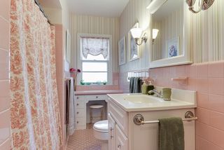 Charming full bath on main level with built-in cabinet