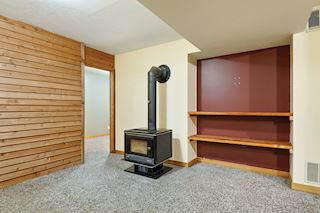 bonus room in lower level with wood burning stove
