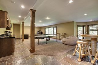 This Lower level space accommodates activities for everyone - table tennis, billiards - you name it.
