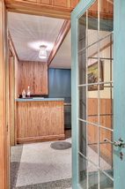 French Doors that adjoin the Billiard Room lead to the original Bamboo Tiki Bar