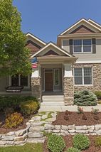 Warm and inviting entry. Dry laid stone walls to highlight extensive landscaping.