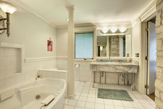 Heated tile floor-cobble stone walk-in shower-marble vanity