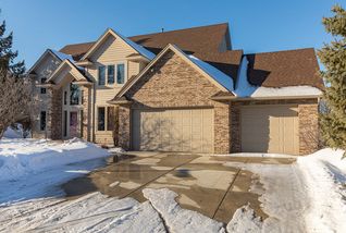 Concrete driveway - brick accents - 3 stall garage