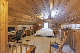 Charming upper level bedroom with lots of storage and closet space...