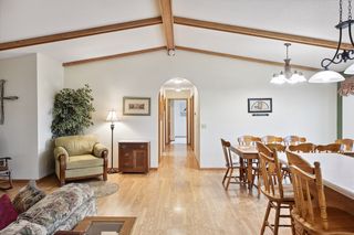 Hallway to 3 bedrooms, laundry, and  2 baths (1 full and 1 ensuite)