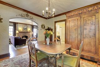 The Dining Room features Hardwood Floors, Piano Style Windows & Original Light Fixture. 