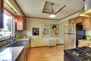 The Light-Filled Kitchen features Stainless Steel Appliances & High-End Lighting...