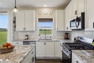 The home baker and chef will enjoy the multi-functionality of this lovely kitchen.