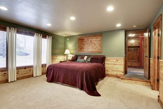 The bedroom space has blended the different woods along with a gas fireplace to take off the evening chill.