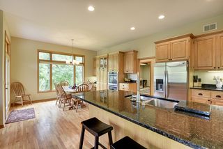 The counter has room for multiple stools and opens to the informal dining 