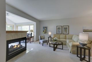 Cozy fireplace in living room and sun porch...