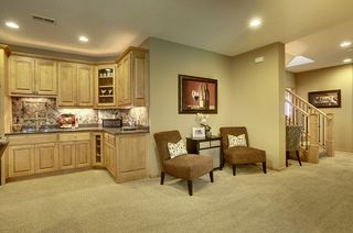 Lower level bar, custom built ins and accent lighting above cabinets
