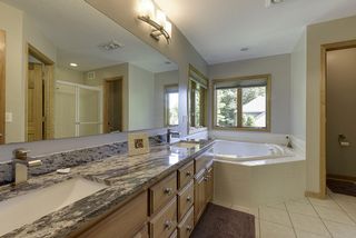 New granite countertops, cabinetry pulls, and faucets trim out the master bath