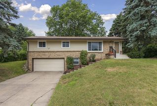 Maintenance free siding, updated rail & concrete steps.