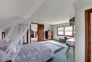 Another view of the upstairs bedroom leading into the loft area