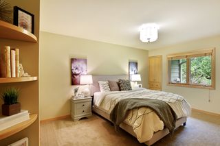 Third main floor bedroom with built-in bookcase and large closet
