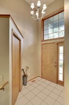 Foyer with 13 ft. Ceilings, tiled entry. 
