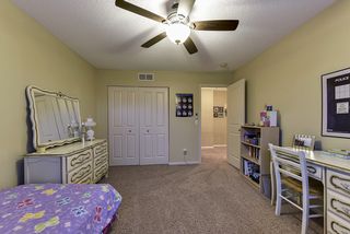 Bedroom 3 with ceiling fan on the upper level
