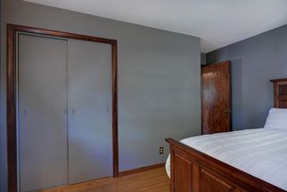 Spacious master bedroom with gleaming hardwood floors