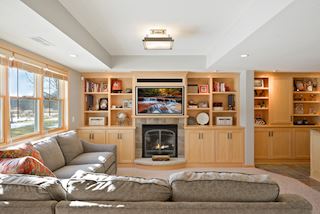 Entertainment center with fireplace, and large TV