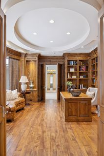Wood floors and built-in book cases create a warm and relaxing atmosphere.