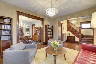 The Living Room adjoins the Dining Room (both rooms feature Hardwood Floors)...